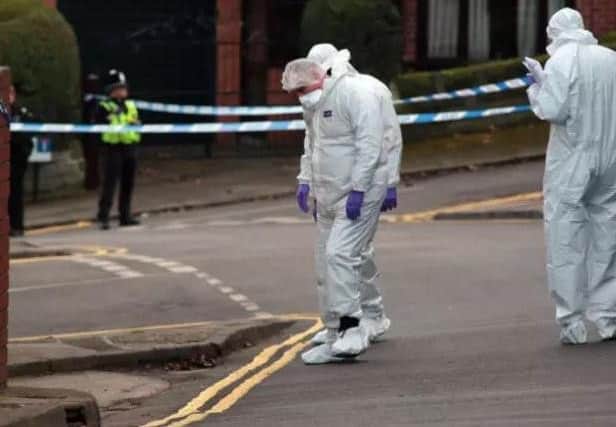 Forensic officers scour the scence on Daniel Hill. Picture: Glenn Ashley/The Star