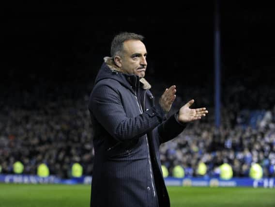 Carlos Carvalhal looks dejected as he applauds the fans at the final whistle