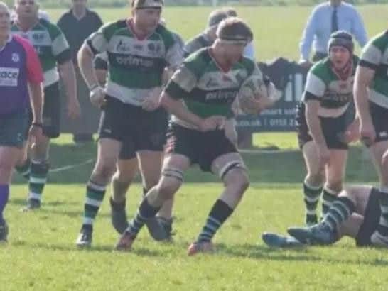Gareth is pictured with the rugby ball.