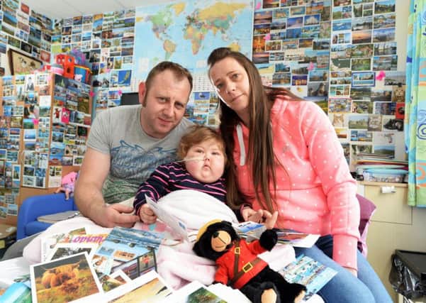 Two-year-old Jessie Stocks from Barnsley, a cancer sufferer who has been in hospital for 17 months, has been sent hundreds of postcards from around the world to brighten up her room in Sheffield Childrens Hospital, after an online appeal by her mum reached over 500,000 people on the YP Facebook page, pictured with her father and mother Sam and Mel.
19 May 2017.  Picture Bruce Rollinson