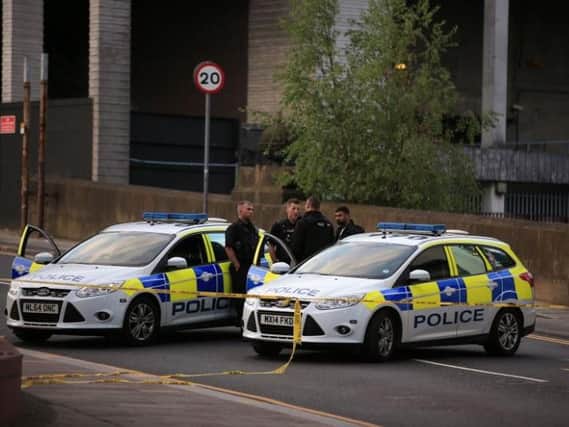 Police officers at the Manchester Arena after an attack last night