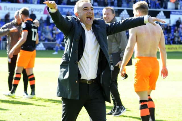 Carlos Carvalhal celebrates earning a play-off place against Ipswich Town