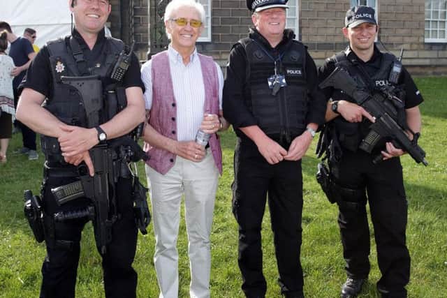 Armed police keeping South Yorkshire icon Tony Chrostie and everyone else safe  at Wentworth Music Festival