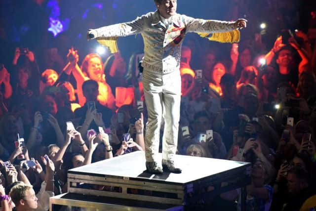 Mark Owen on stage.