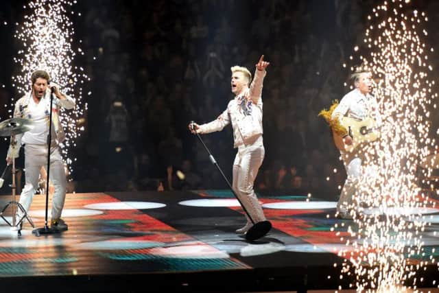 Take That on stage.