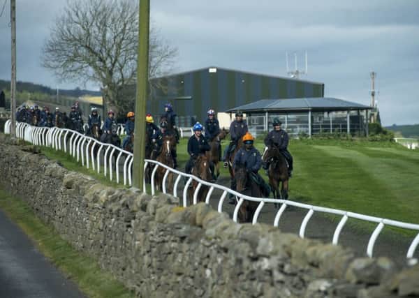 Jockeys riding out at Mark Johnston's yard in Middleham, Yorkshire, which hopes to be celebrating its first Investec Derby winner on Saturday, courtesy of Permian.