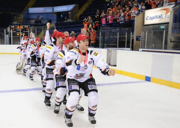 Tim Spencer  and  2014 team celebrate a Playoff Final win