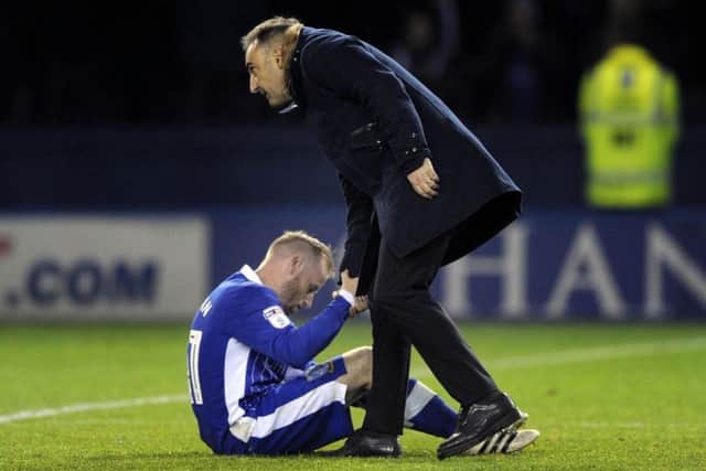 Carlos Carvalhal offers Barry Bannan a conciliatory hand up after play-off defeat to Huddersfield