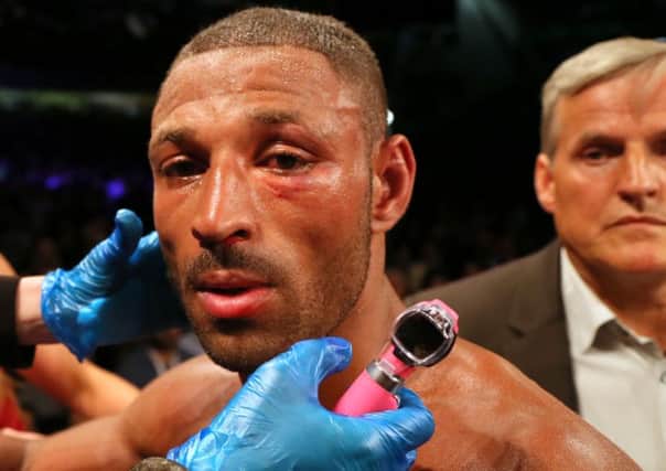 Kell Brook is checked over by the medical team after his IBF Welterweight World Championship bout v Errol Spence at Bramall Lane, Sheffield.