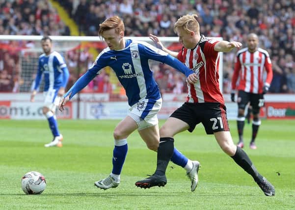 Picture Andrew Roe/AHPIX LTD, Football, EFL Sky Bet League One, Sheffield United v Chesterfield Town, Bramall Lane, 30/04/17, K.O 12pm

Chesterfield's Jon Nolan battles with United's Mark Duffy

Andrew Roe>>>>>>>07826527594