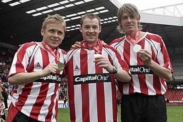 United's three ex-Owls - Derek Geary, Alan Quinn and Bromby - celebrate promotion to the Premiership in 2005/06