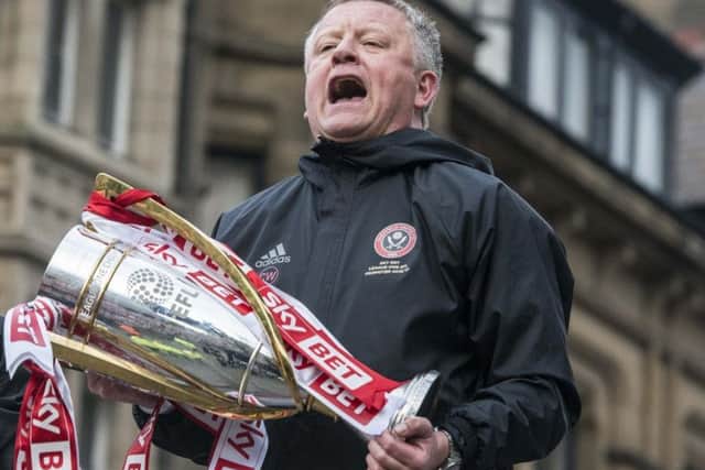 Chris Wilder with the League One trophy