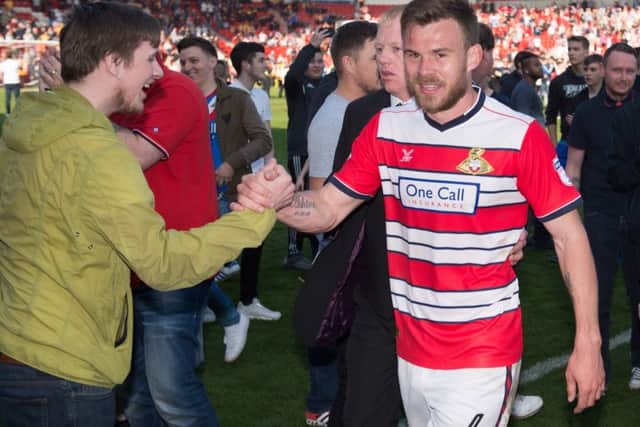 Flashback - Doncaster Rovers' Andy Butler celebrates promotion with the fans after the Mansfield match. Photo: Jon Buckle/PA Wire.