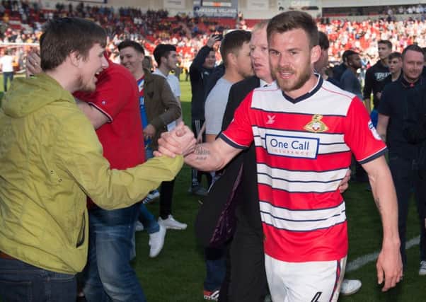 Flashback - Doncaster Rovers' Andy Butler celebrates promotion with the fans after the Mansfield match.  Photo: Jon Buckle/PA Wire.