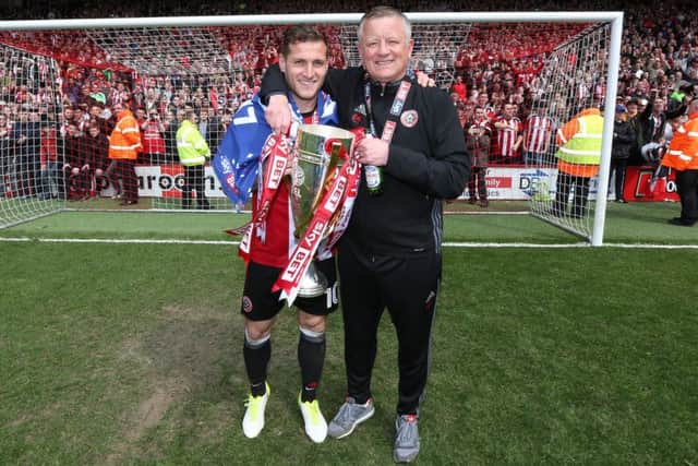 Sheffield United's Billy Sharp and Chris Wilder celebrate with the League One trophy