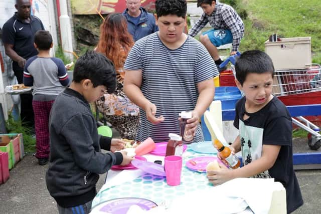 Local kids get together for a BBQ at the Know Your Neighbour event at Pitsmoor Adventure Playground, Sheffield, United Kingdom, 10th June 2017. Photo by Glenn Ashley.
