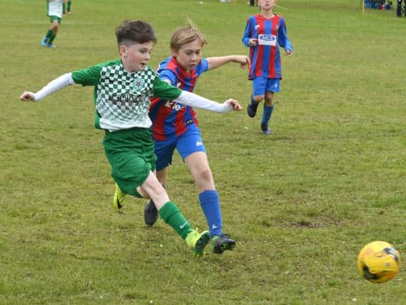 Armthorpe Rovers and Bessacarr Greens battle it out in the U11s section. (Photo: Andrew Roe).
