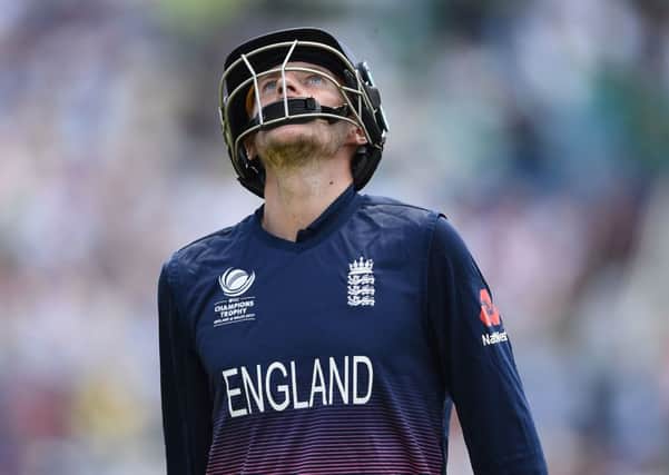 England's Joe Root shows his dejection as he leaves the field after being dismissed for 46 during the ICC Champions Trophy, semi-final match at the Cardiff Wales Stadium