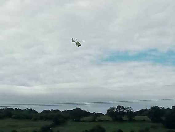 An air ambulance landed in Owlthorpe this morning after a woman fell from a window