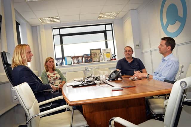 Dr. Sam Chapman, Chief Innovation Officer and Co-Founder, Michelle Futter, HR Leader, Paul Say, Marketing Lead, of The Floow, pictured with David Walsh, Sheffield Star Business Editor. Picture: Marie Caley NSST Floow MC 2