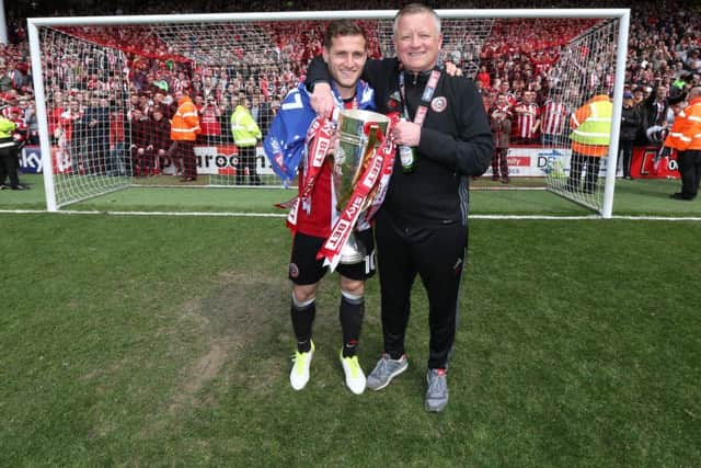 Sheffield United's Billy Sharp and Chris Wilder celebrate with the trophy. Pic David Klein/Sportimage