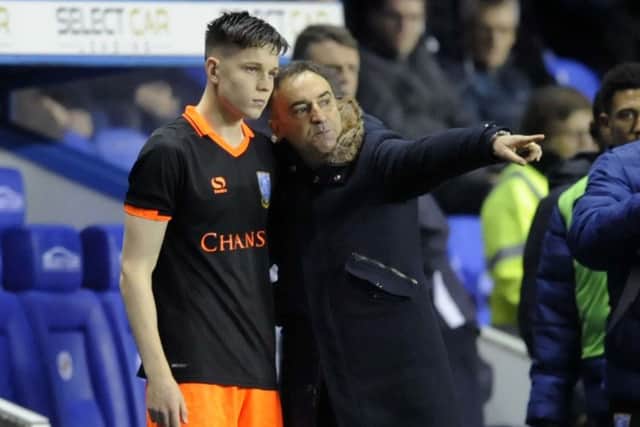 George Hirst coming on for his first team debut at Reading gets instructions from Carlos Carvalhal