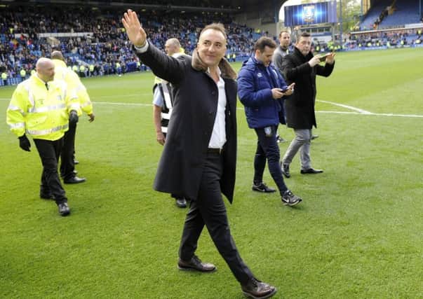 Carlos Carvalhal salutes the fans at the end of the regular season at Hillsborough