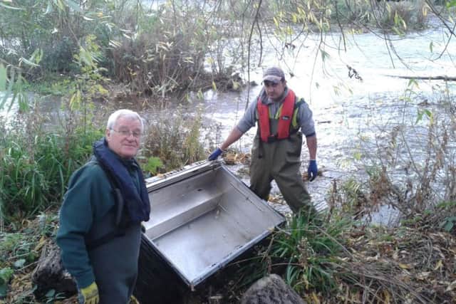 Volunteers Tony and Hayder with a fridge found in the Don