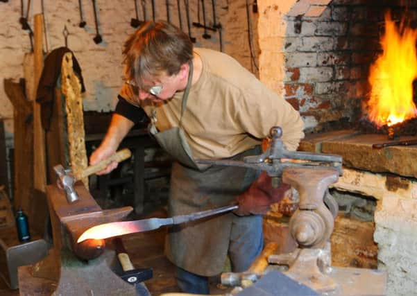 Knife-maker Duncan Edwards at work in his forge
