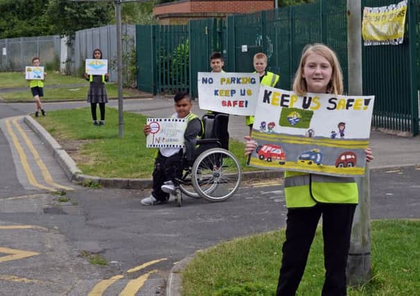 Year six children at Lakeside primary school pictured campaigning against people parking outside their school, taking a stand to promote the safety of the children. Picture: Marie Caley NDFP Parking Protest MC 3