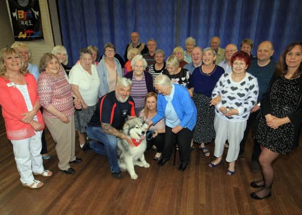 Adrian Ashworth and Thunder his husky visited the memory cafe for people with dementia at the Saint Thomas More Community Centre.