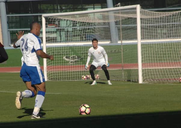 Chris O'Grady shapes to shoot against Benfica B