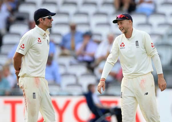 England's captain Joe Root (right) with Alastair Cook during day two of the First Investec Test match at Lord's. Photo: Nigel French/PA Wire.