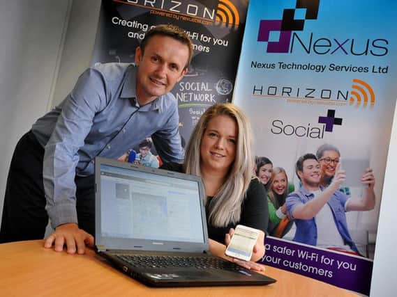 SocialPlus media manager Emma Crowe with Nexus Horizon MD Paul Sykes and their Facebook post