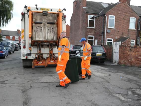 Binmen collecting refuse in Doncaster
