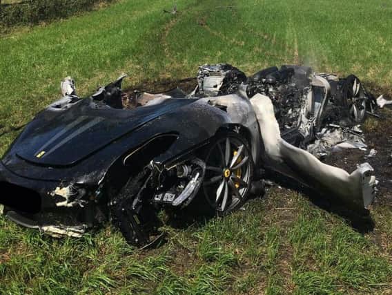 What was once a supercar - the smashed and melted Ferrari. Photo: SYP Operations/Twitter