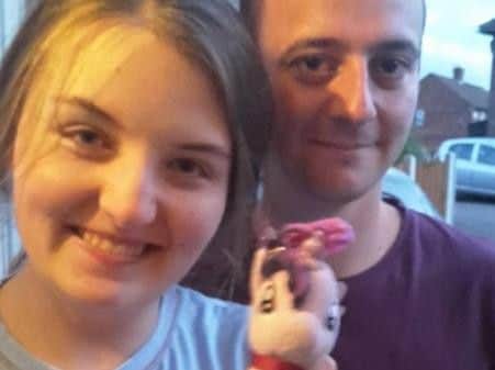 Katie Elliott and Sam Deakin with the toy.