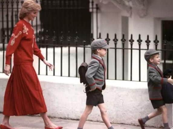 The Princess of Wales following Prince Harry (right), five, and Prince William, seven, on Harry's first day at the Wetherby School in Notting Hill, West London. Ron Bell/PA Archive/PA Images.