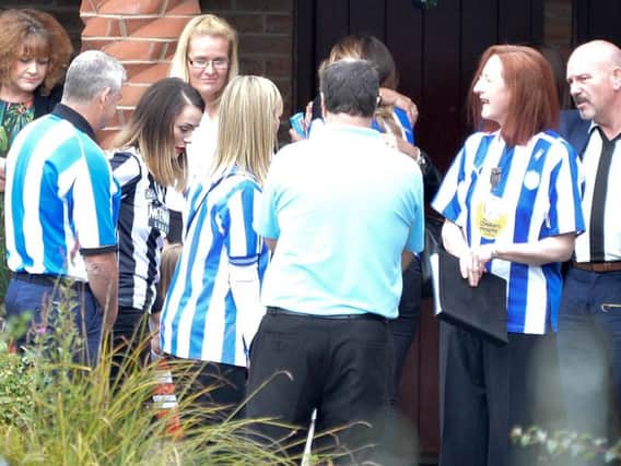Mourners in Sheffield Wednesday shirts at Ross Blair's funeral. (Photo: SWNS).