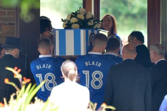 The coffin was decked out in Sheffield Wednesday colours.