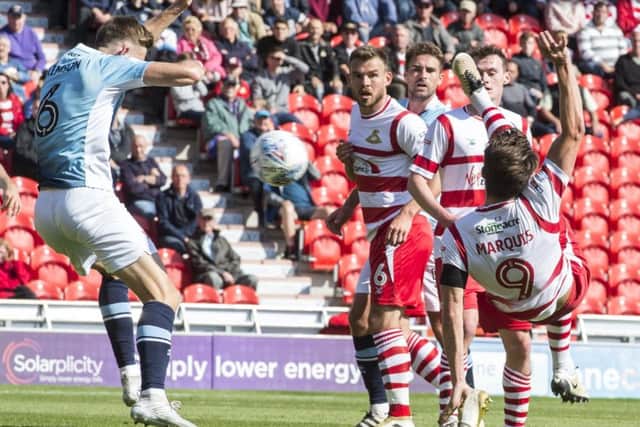 John Marquis scores the spectacular second goal for Rovers. Photo: Dean Atkins