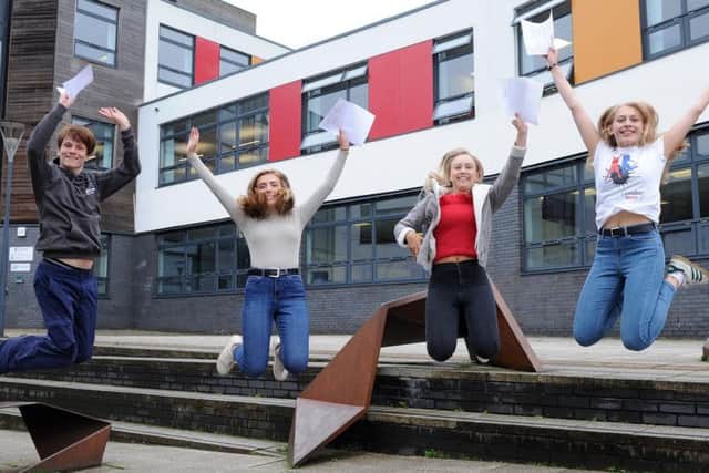 (l-r) Silverdale students Mark Whithers Kate Whiteley, Ellie Millen and Grace Bourne jump for joy as they celebrate getting their A Level results.