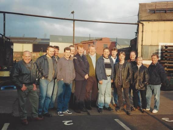 Band members with the cast of The Full Monty during filming