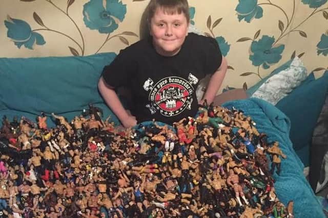 Bobby with his huge collection of wrestling figures.
