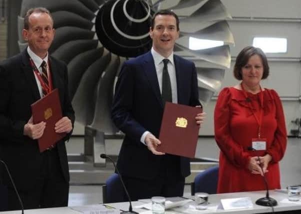 Sir Steve Houghton and Julie Dore with then chancellor George Osborne signing up to devolution in 2015.