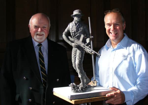 Howard Potts and artist Steve Winterburn, of Yorkshire Fine Arts, with a model of the planned Kings Own Yorkshire Light Infantry memorial