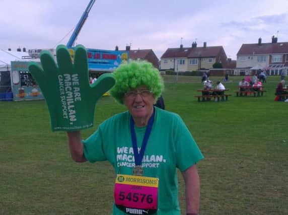 John Burkhill with his familiar green wig after completing the Great North Run