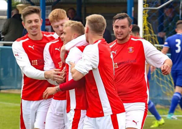 Brodie Litchfield celebrates with team mates after completing his hat-trick in Stocksbridge's 9-1 win
