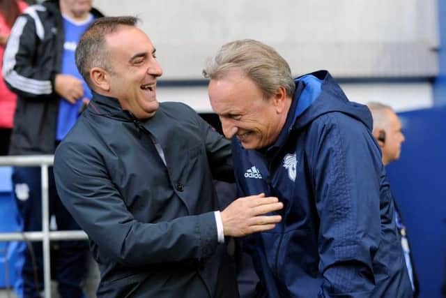 Carlos Carvalhal shares a joke with Cardiff City boss Neil Warnock