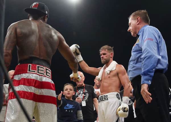 Billy Joe Saunders (right) and his son shake hands with Willie Monroe Jnr after the WBO World Middleweight Championship bout
